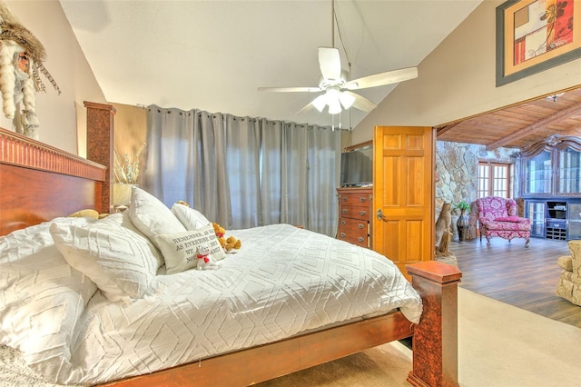 bedroom with ceiling fan, lofted ceiling, and hardwood / wood-style floors