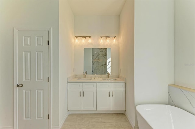 bathroom featuring a tub to relax in and vanity