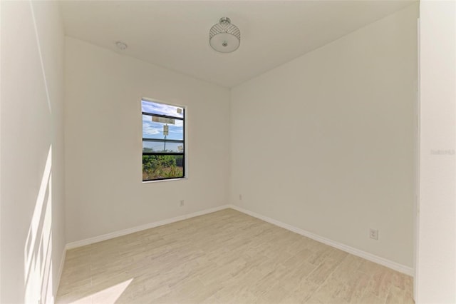 unfurnished room with light hardwood / wood-style flooring