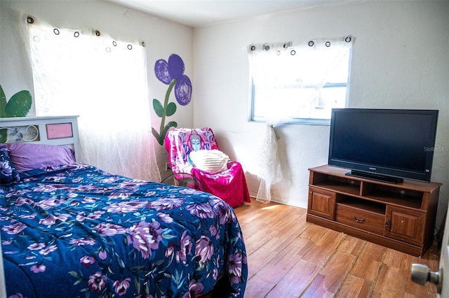 bedroom with light hardwood / wood-style floors