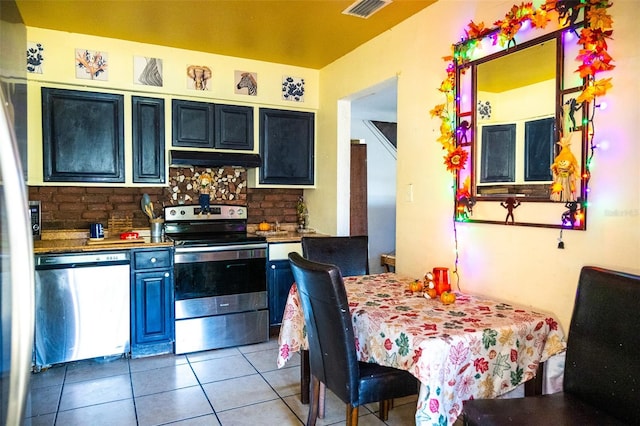 kitchen featuring tasteful backsplash, tile patterned floors, and appliances with stainless steel finishes