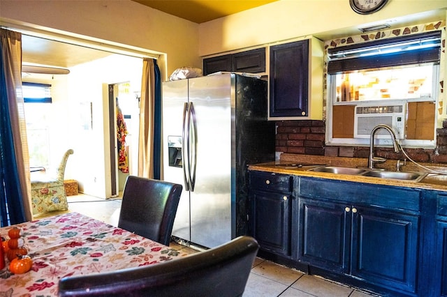 kitchen featuring stainless steel fridge, light tile patterned flooring, sink, and cooling unit