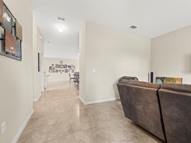 corridor featuring light tile patterned floors