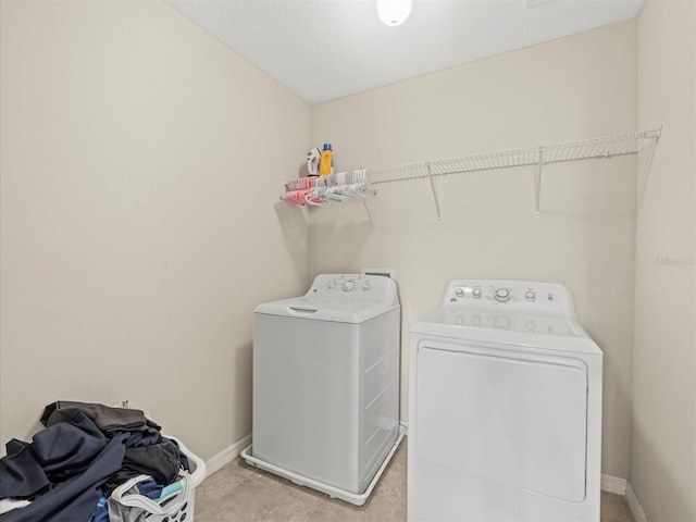 washroom featuring independent washer and dryer