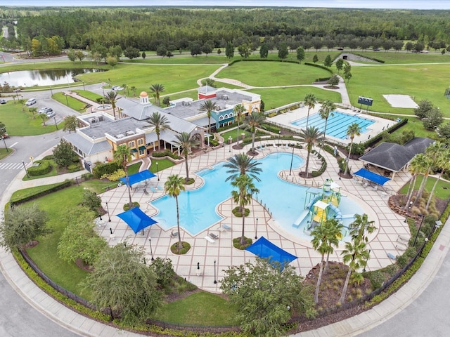 birds eye view of property with a water view