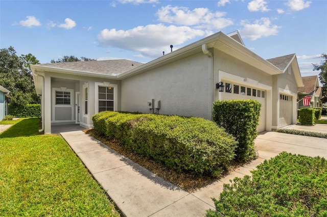 single story home featuring a front yard and a garage