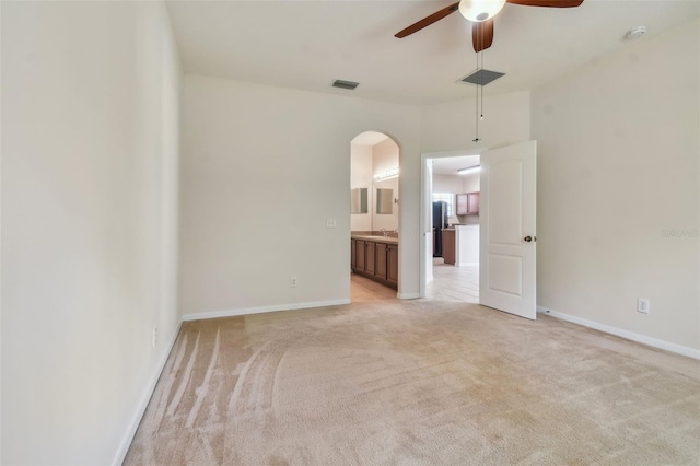 carpeted empty room with ceiling fan