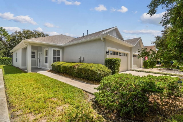 ranch-style home with a front yard and a garage