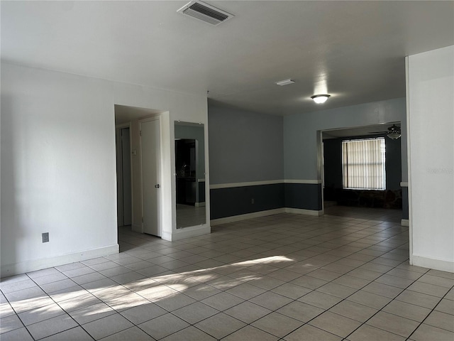 spare room with light tile patterned floors