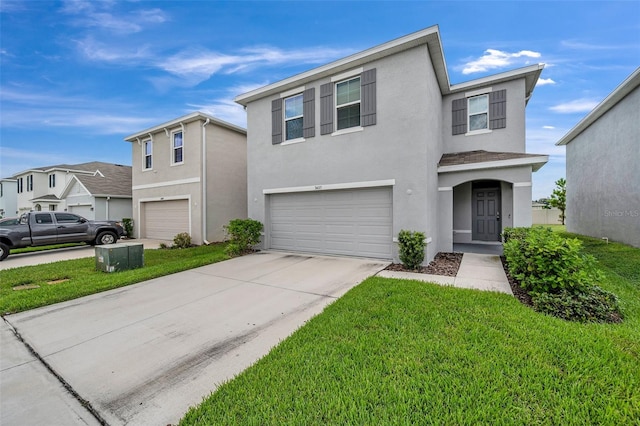 view of front of home with a garage and a front lawn