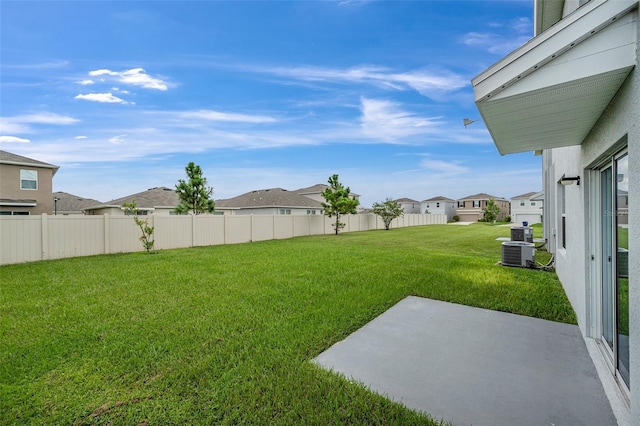 view of yard with a patio area and central AC