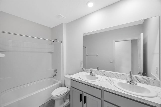 full bathroom featuring toilet, shower / bathing tub combination, and vanity