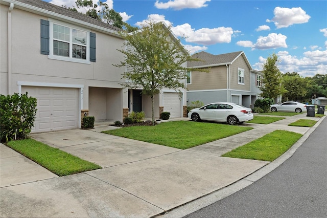 view of front facade with a garage and a front yard