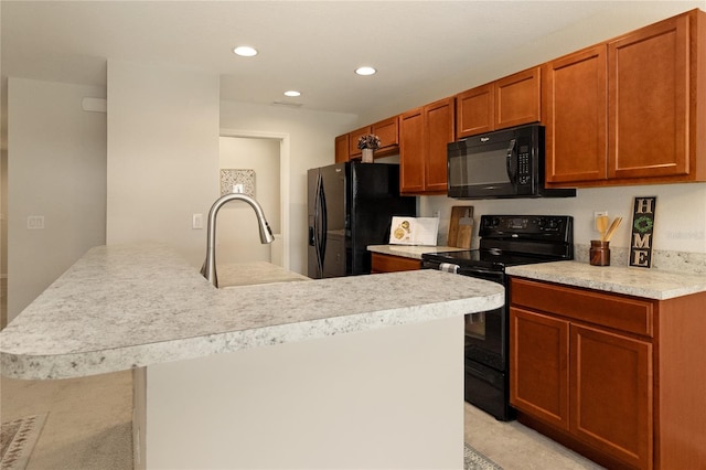 kitchen with black appliances and sink