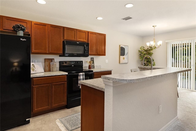 kitchen with hanging light fixtures, an inviting chandelier, light colored carpet, black appliances, and an island with sink