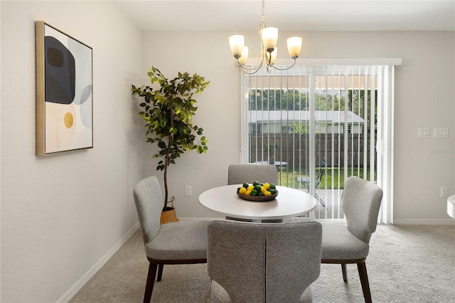 dining area featuring an inviting chandelier and carpet floors