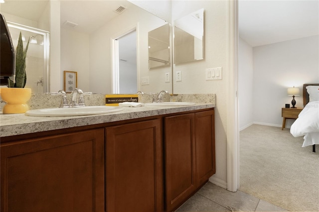 bathroom with vanity and an enclosed shower