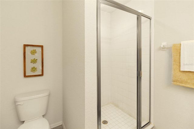 bathroom with toilet and walk in shower