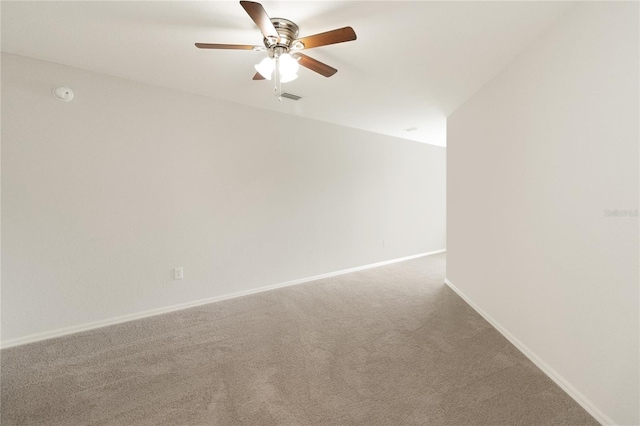 unfurnished room featuring ceiling fan and carpet floors