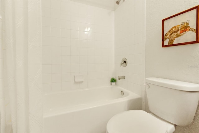 bathroom with toilet and shower / tub combo