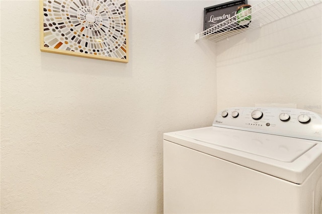 clothes washing area with washer / clothes dryer