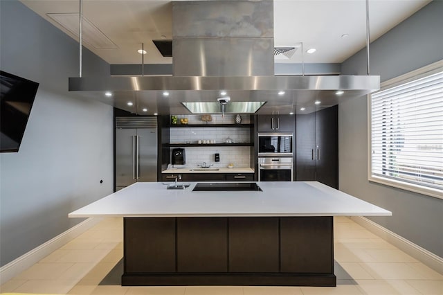 kitchen featuring decorative backsplash, light countertops, modern cabinets, open shelves, and built in appliances