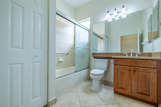 full bathroom featuring tile patterned flooring, vanity, toilet, and enclosed tub / shower combo