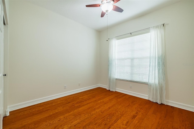 unfurnished room with hardwood / wood-style floors and ceiling fan