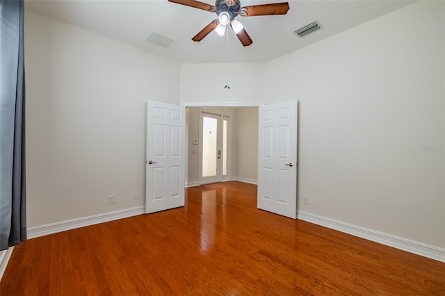 spare room featuring ceiling fan and wood-type flooring