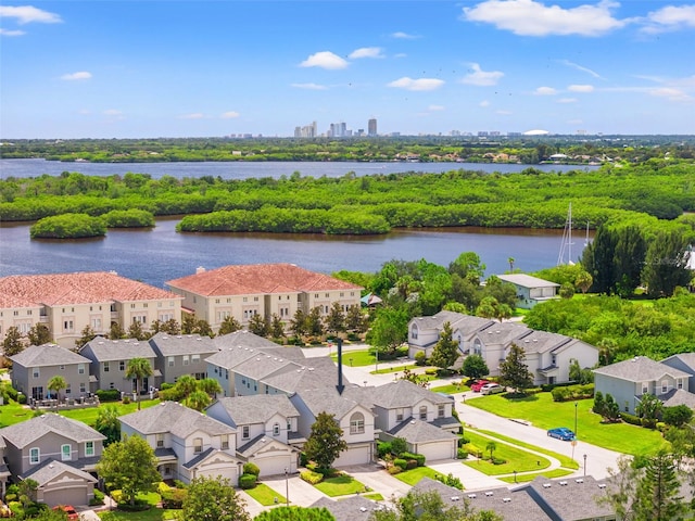 birds eye view of property with a water view