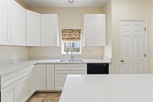 kitchen with sink, white cabinetry, and dishwasher