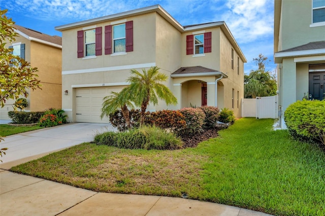 view of front facade with a front yard and a garage