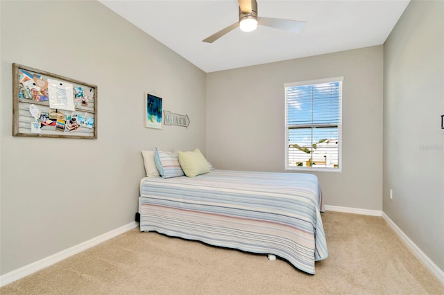 bedroom featuring light colored carpet and ceiling fan