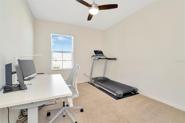 carpeted office featuring ceiling fan