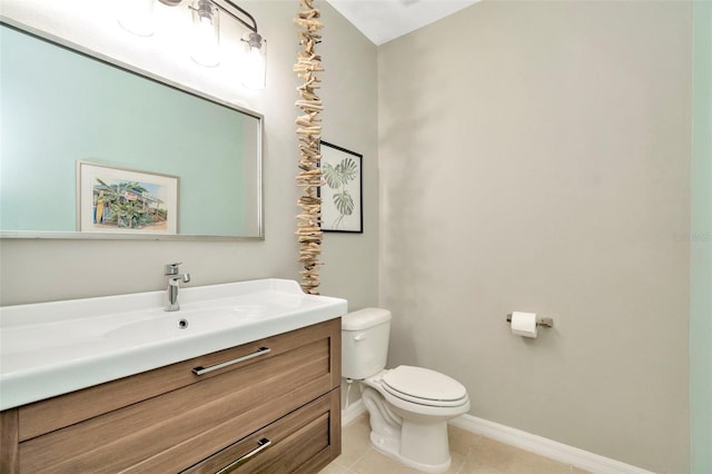 bathroom featuring tile patterned flooring, vanity, and toilet