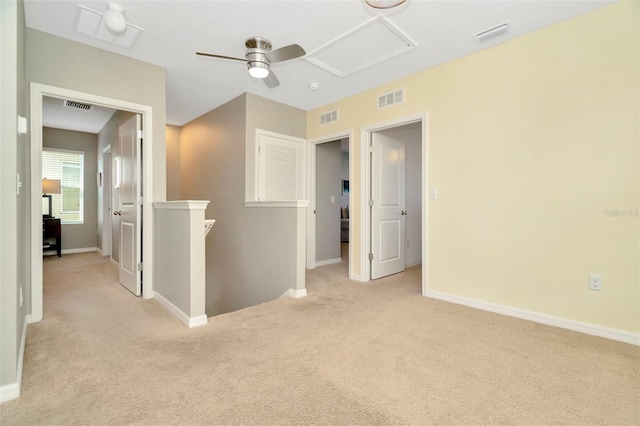 carpeted empty room with ceiling fan