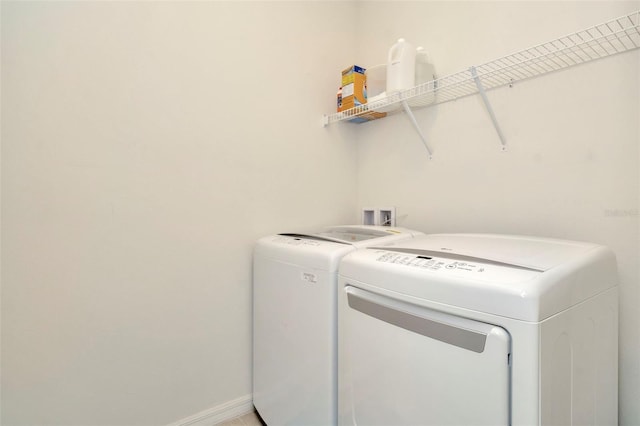 laundry room featuring washer and clothes dryer