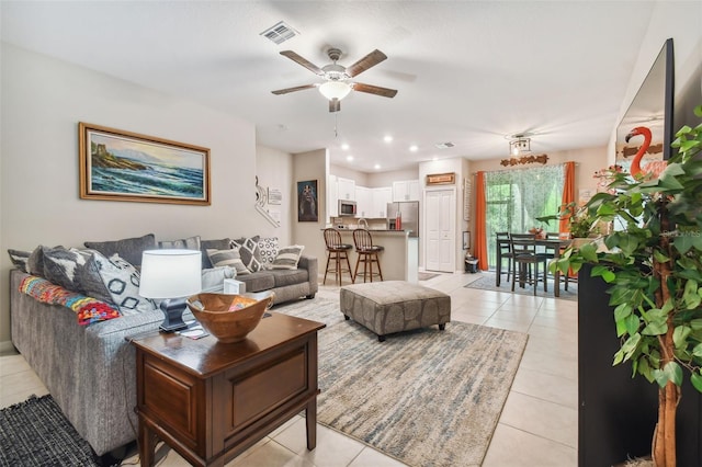 living room with visible vents, recessed lighting, a ceiling fan, and light tile patterned floors
