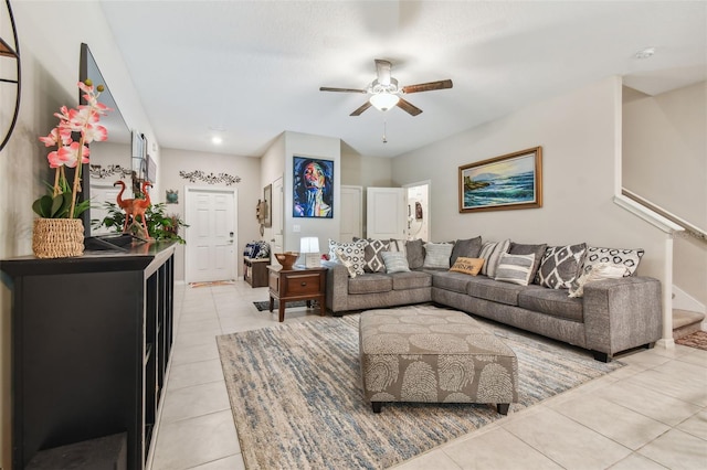 tiled living room featuring ceiling fan