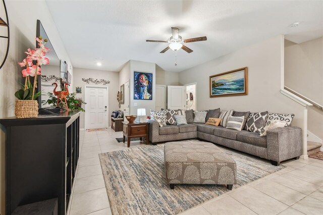 living room with light tile patterned floors and ceiling fan