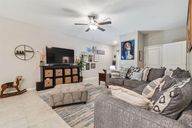 living room with tile patterned floors, baseboards, and ceiling fan