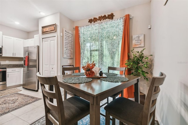 dining area with recessed lighting and light tile patterned floors