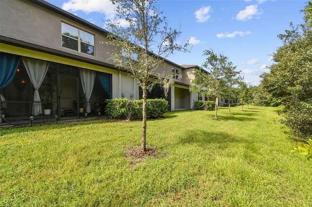 view of yard with a sunroom