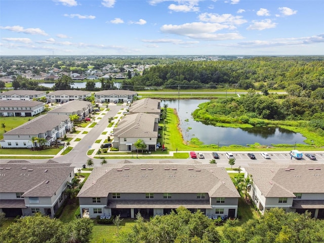 bird's eye view featuring a water view and a residential view
