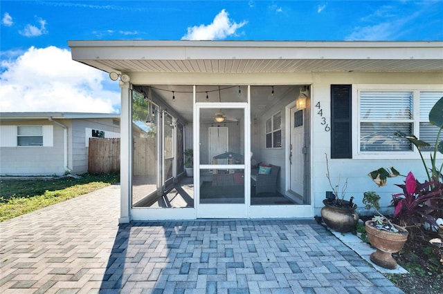 property entrance featuring a patio area