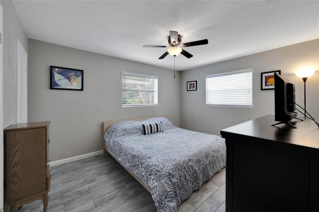 bedroom featuring ceiling fan and light hardwood / wood-style flooring