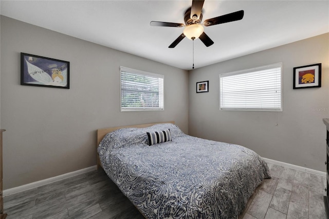 bedroom with hardwood / wood-style floors and ceiling fan