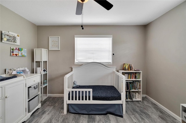 bedroom with hardwood / wood-style floors and ceiling fan