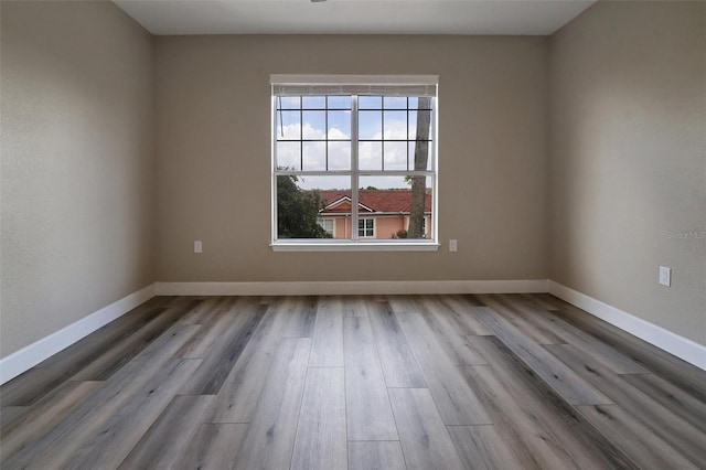 unfurnished room featuring light hardwood / wood-style floors