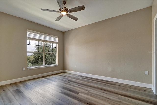 unfurnished room featuring ceiling fan and light hardwood / wood-style floors